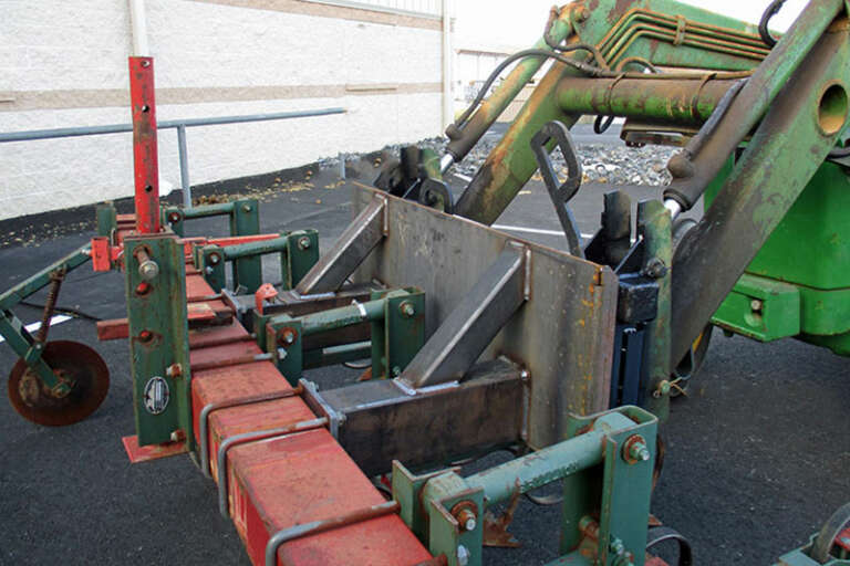 Custom cultivator mounted on quick tach Loader